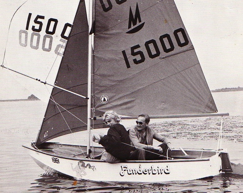 A Mirror dinghy sailing with spinnaker hoisted and helm to leeward